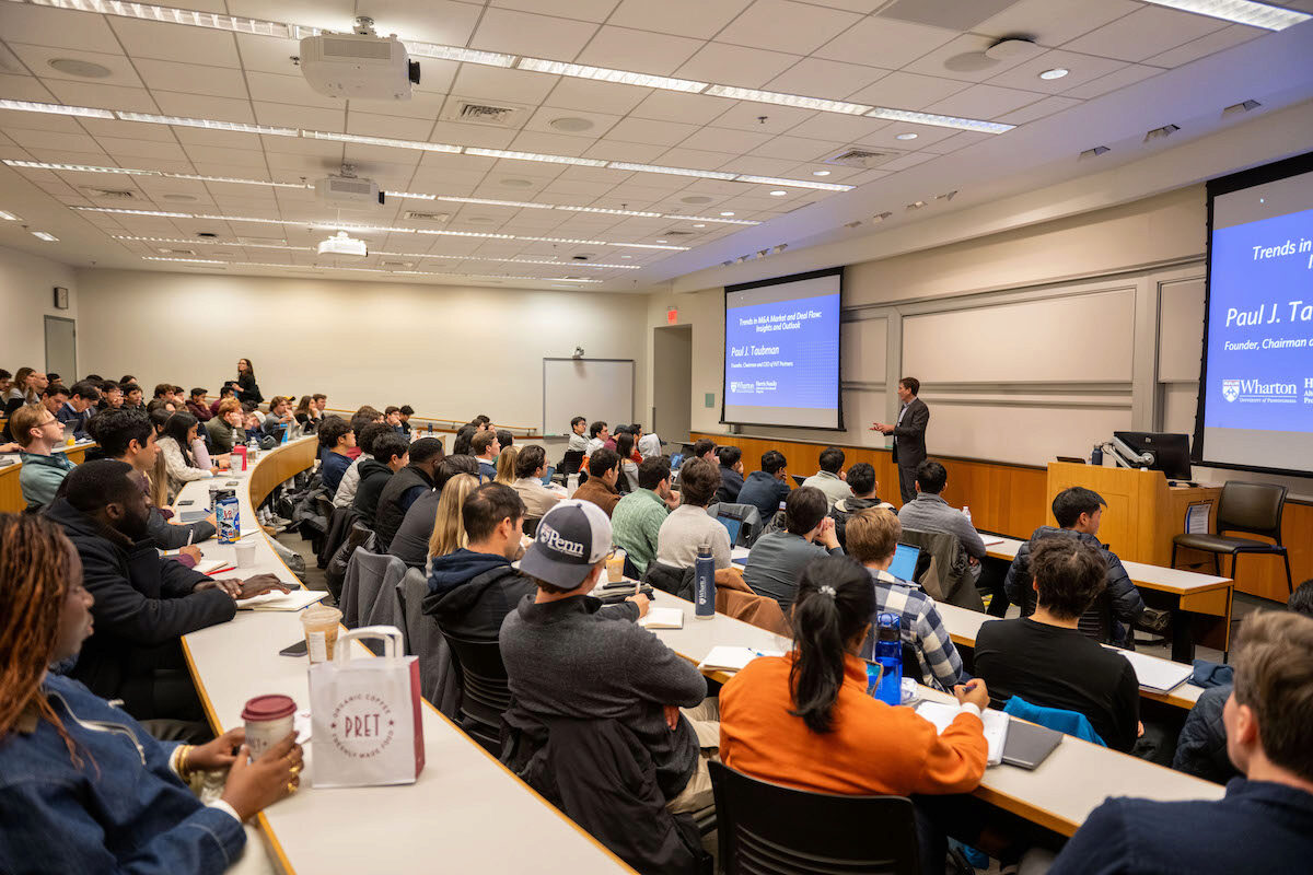 Paul J. Taubman speaks to a full audience