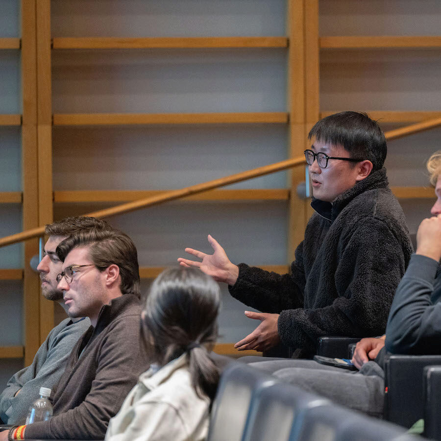 An audience member asks a question at a lecture