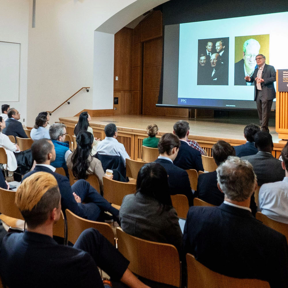 A speaker addresses an audience