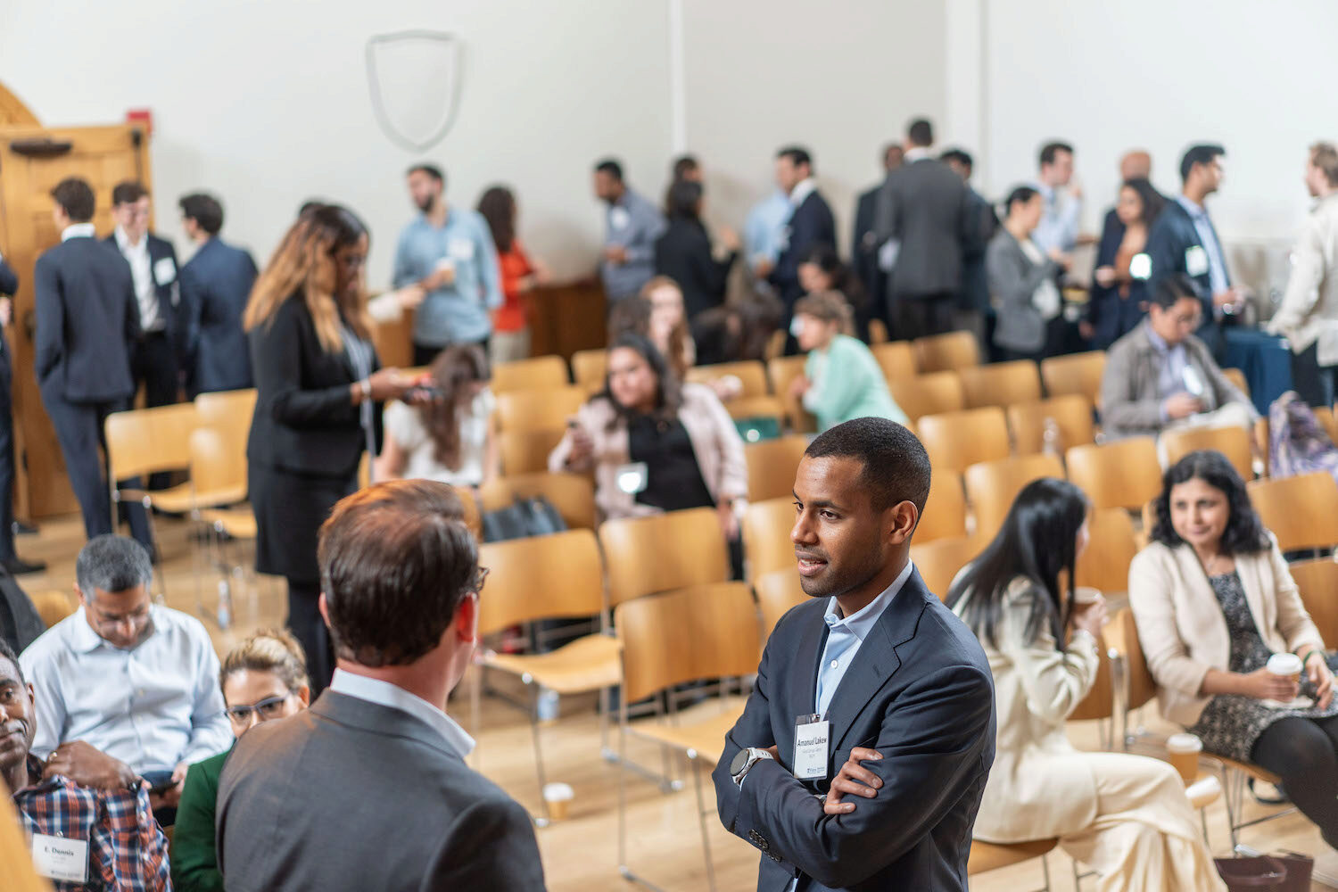 A room full of people networking at a conference