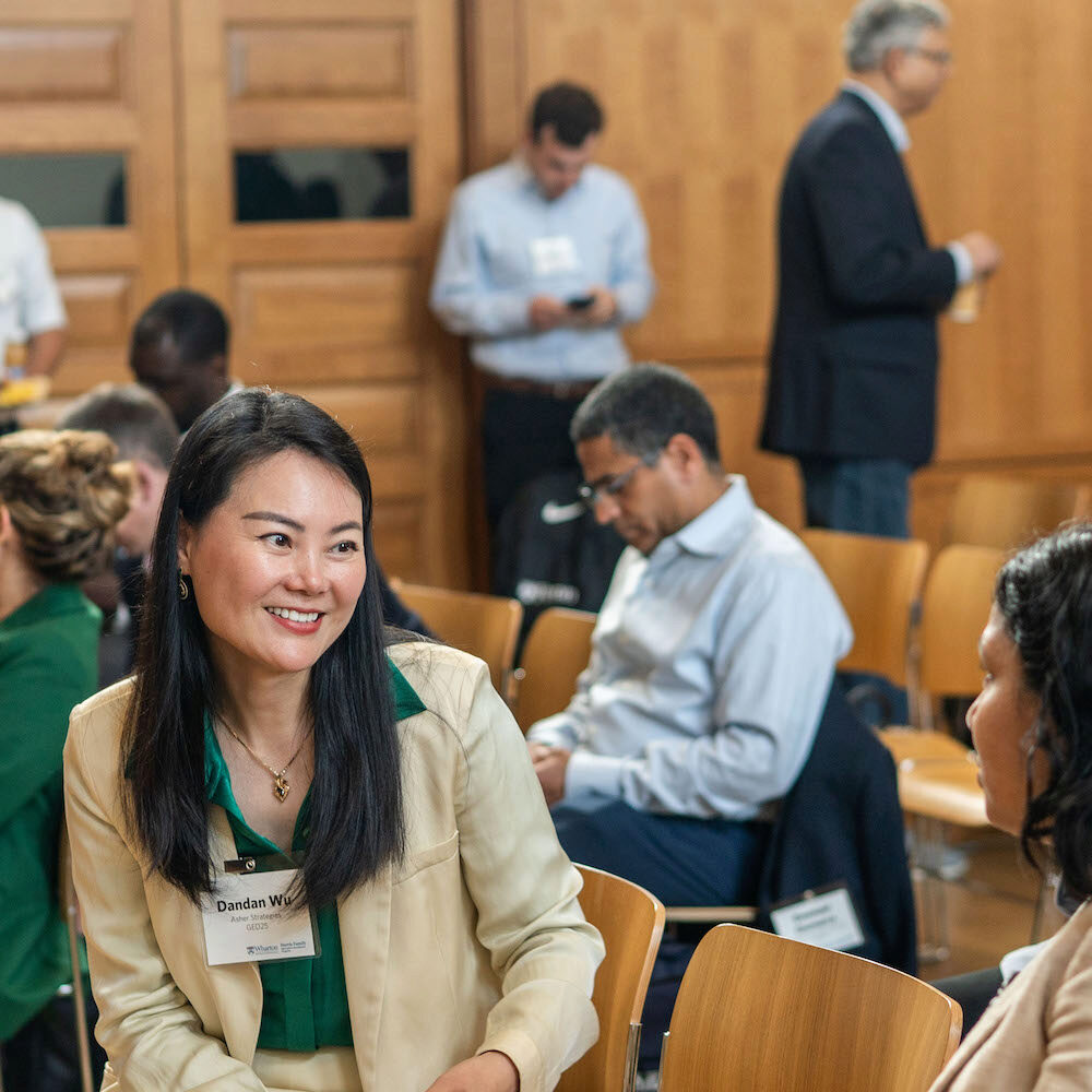 People speaking and networking at an event