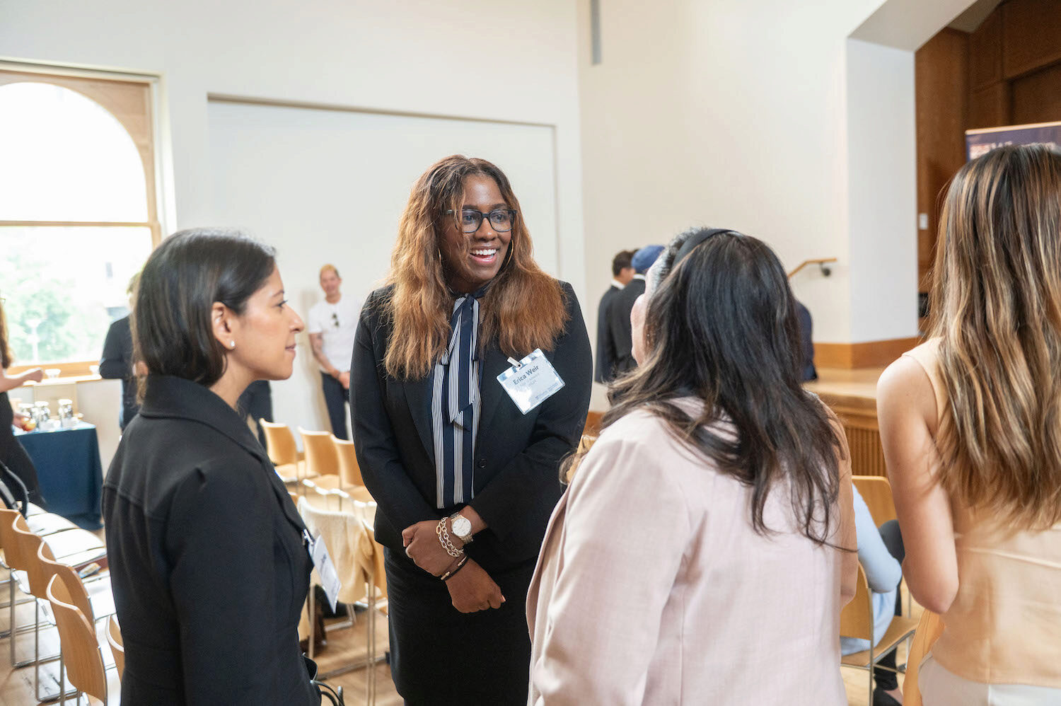 Conference attendees networking and engaging in conversation