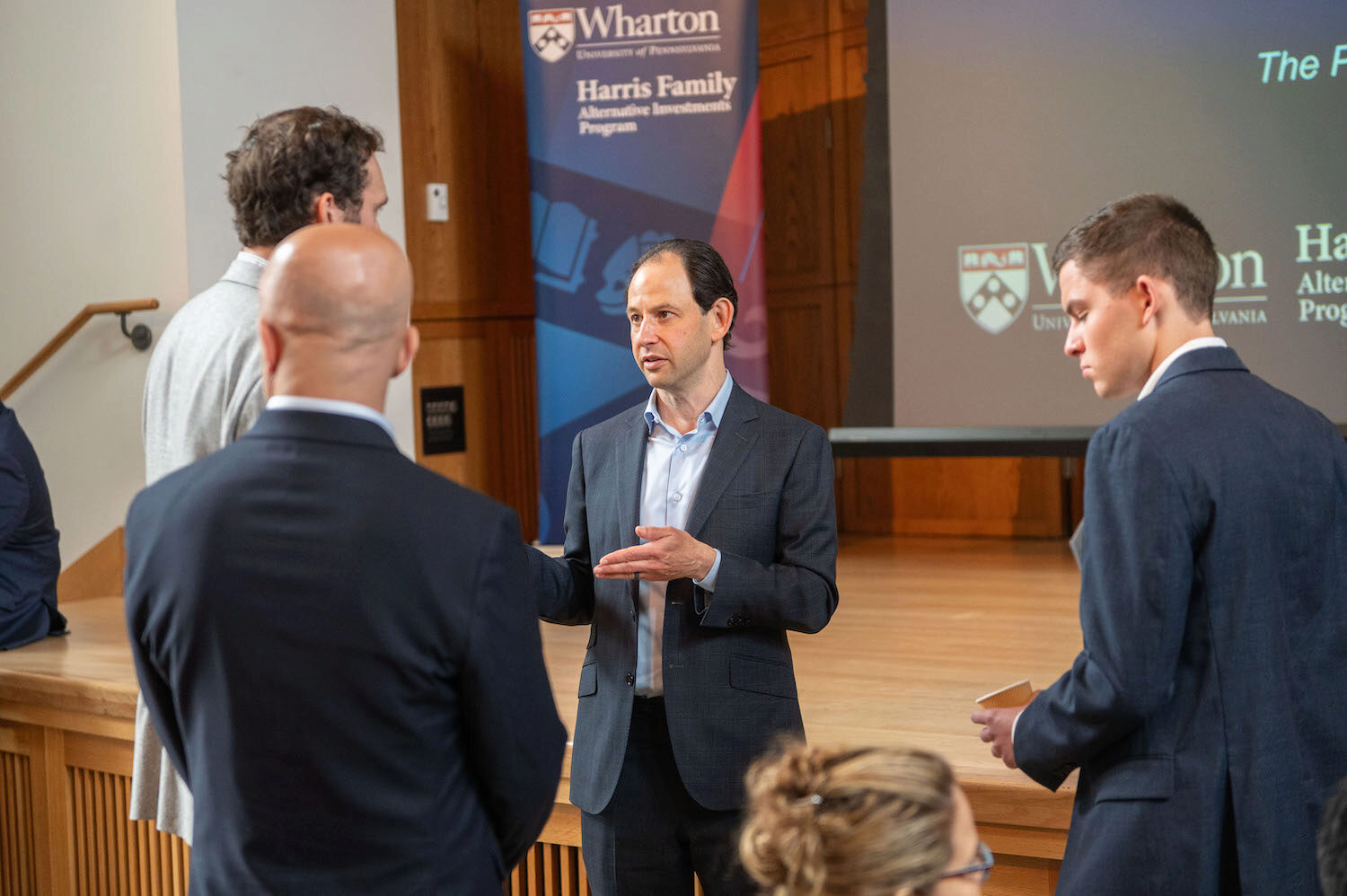 Conference attendees networking and engaging in conversation
