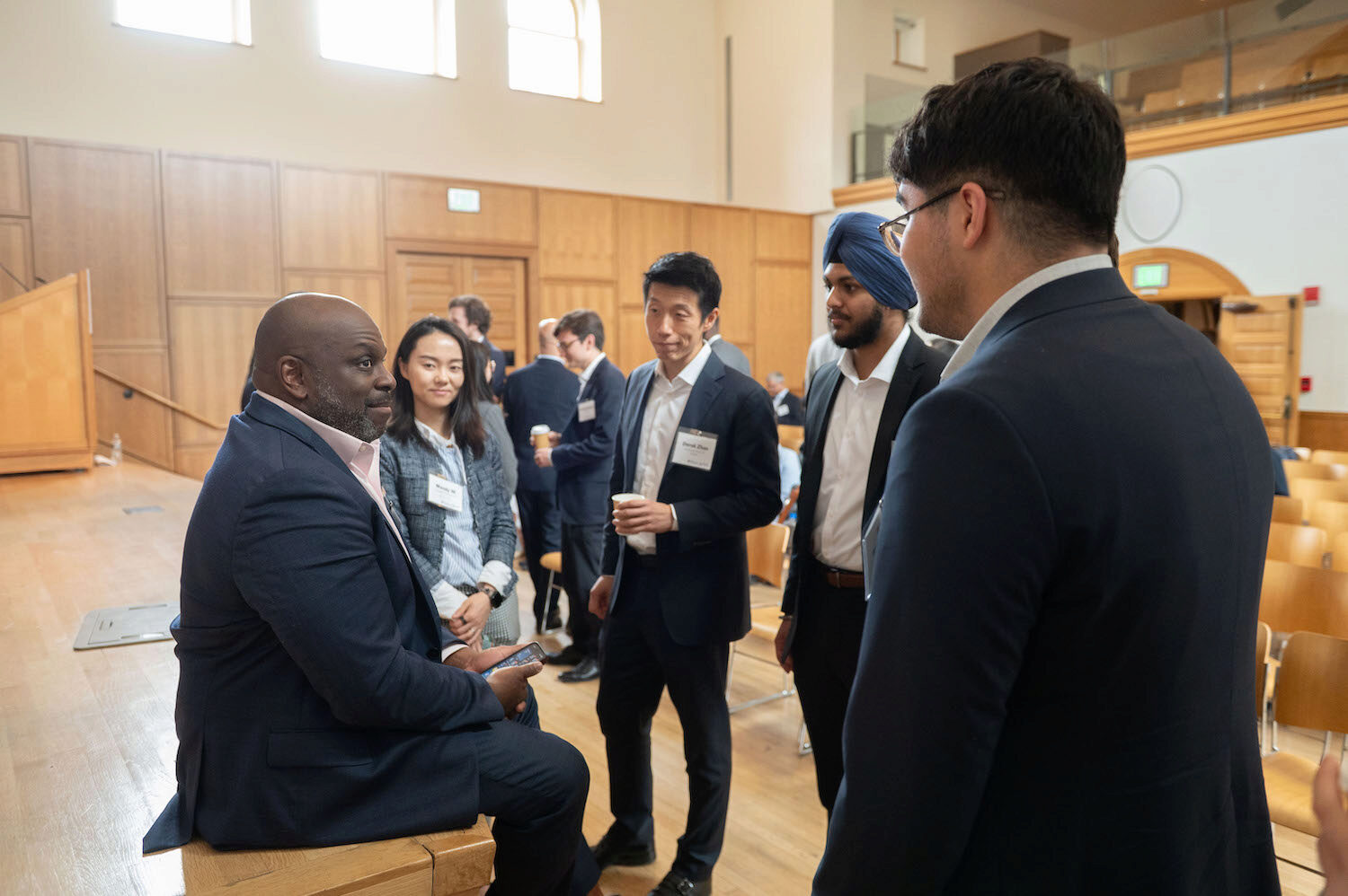 Conference attendees networking and engaging in conversation