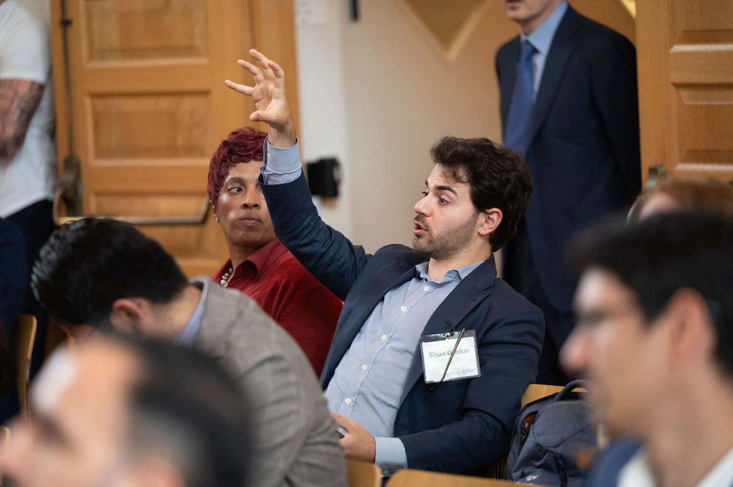 A person motions with his hands, engaged in conversation