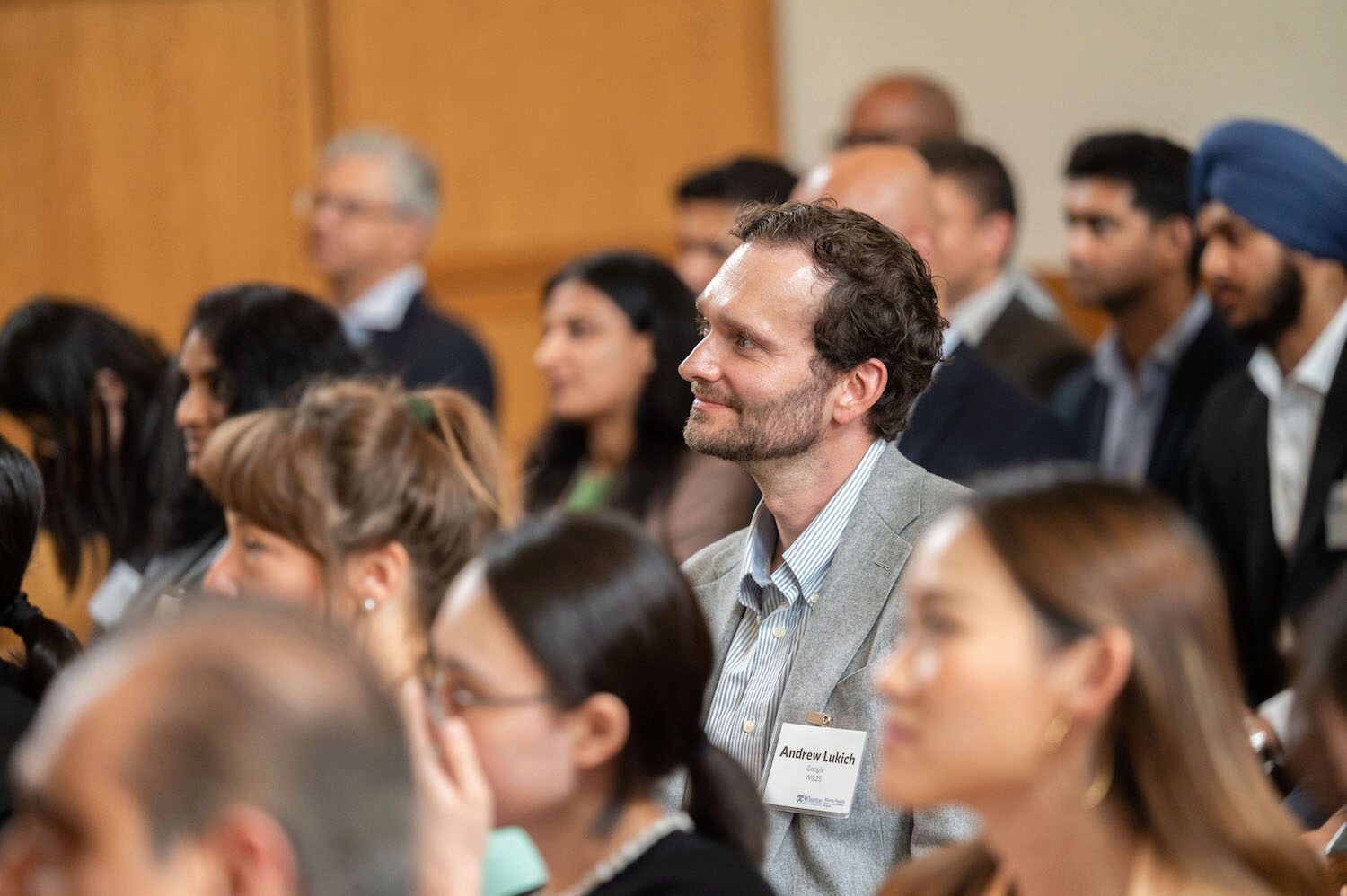 Engaged audience members at a conference