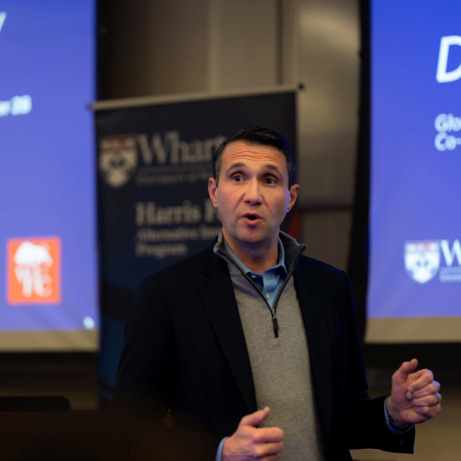 A speaker presents during a fireside chat